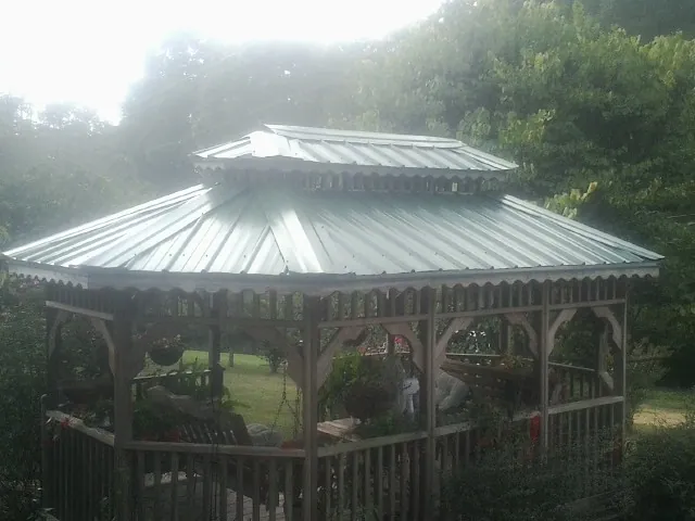 Two tier green metal roof on a garden gazebo in Victoria